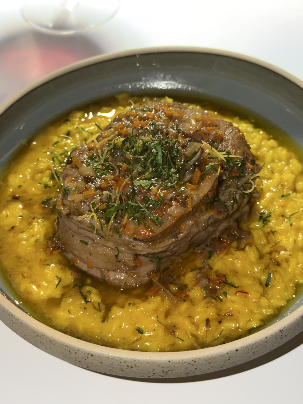 Ossobuco alla Milanese over saffron risotto.