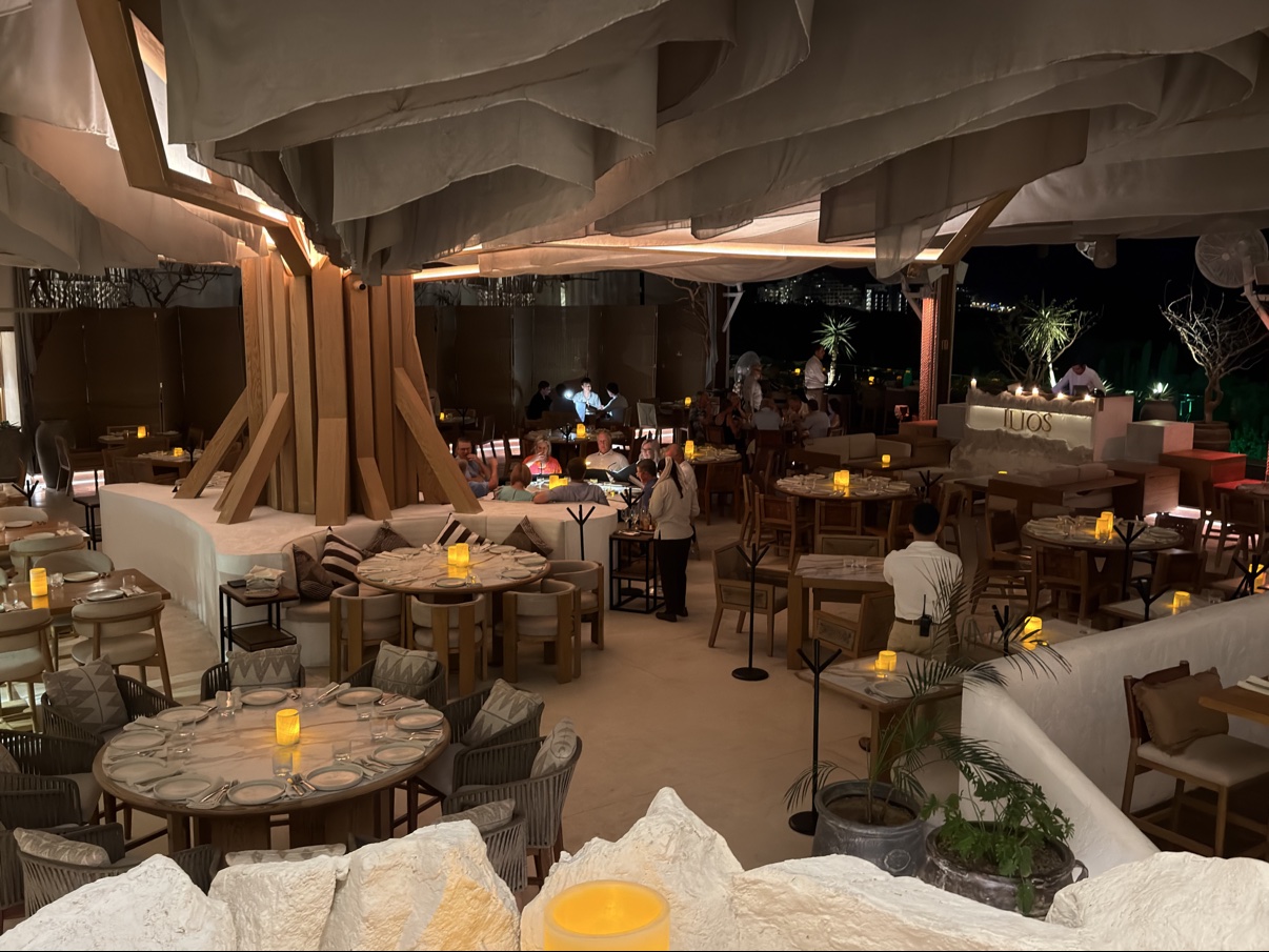The dining room at Ilios, candlelit and wide open to the night air.