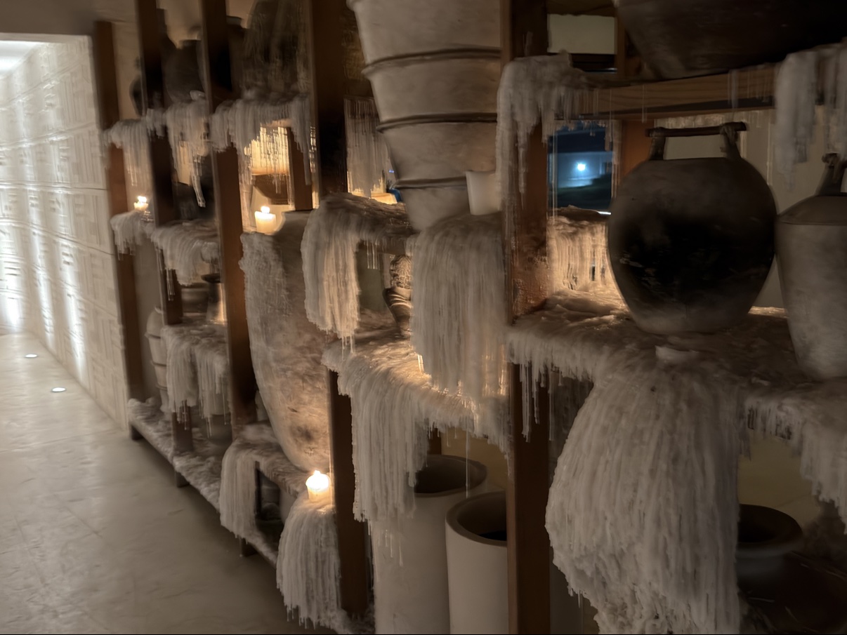 Pottery shelves coated in candle wax — a detail we’d never seen done quite like this.